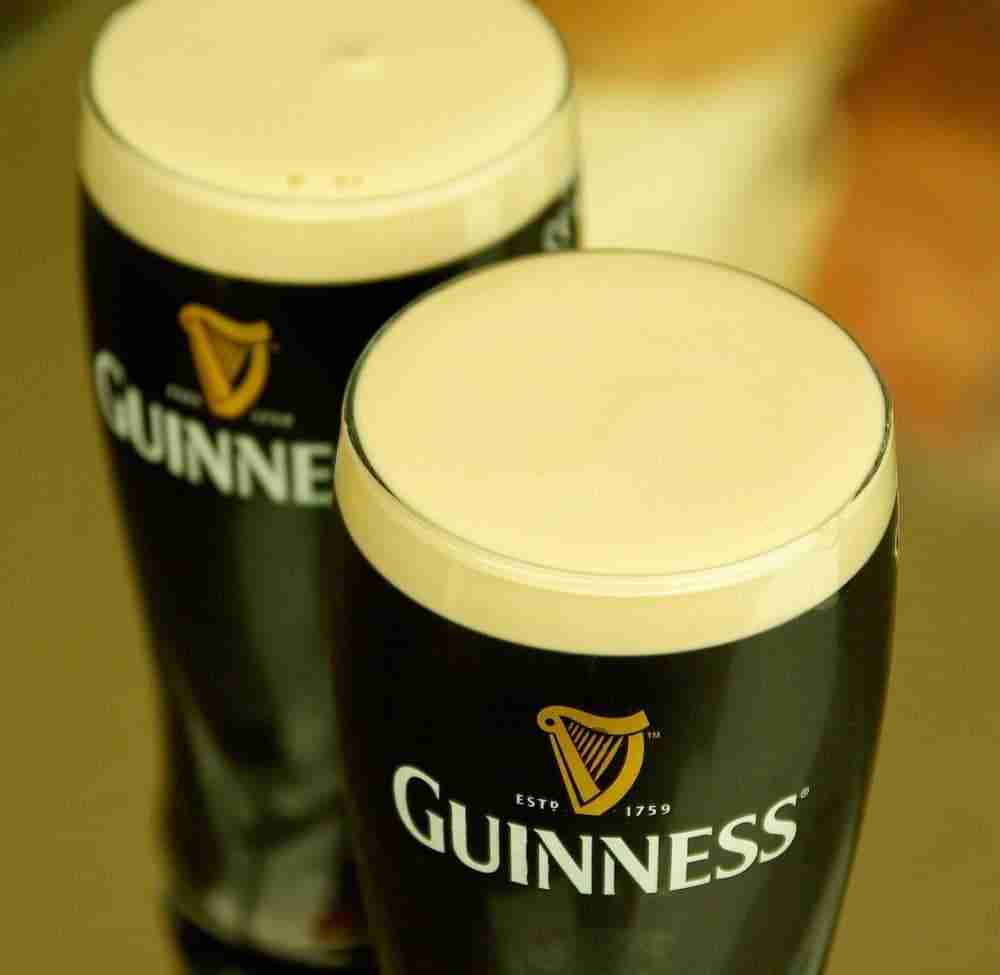 close up of two pints of guinness